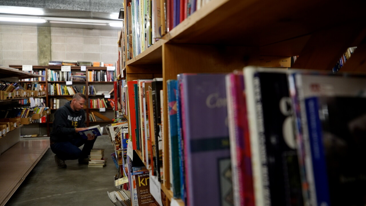 PERSON LOOKIN GTHORUGH BOOKS .jpg