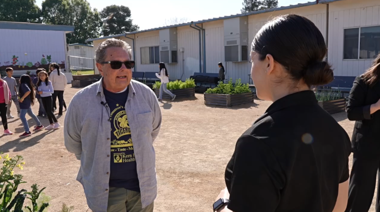 Neighborhood News Reporter Priscilla Lara interviewing James Blackwell, 4th grade teacher at Alicante Middle School in Lamont