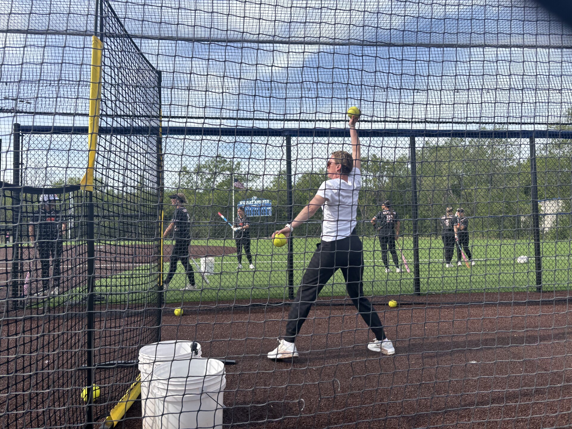 Hartford softball coach won't let ovarian cancer keep her off the field