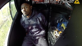 Packers running back Josh Jacobs in the squad car after his arrest.