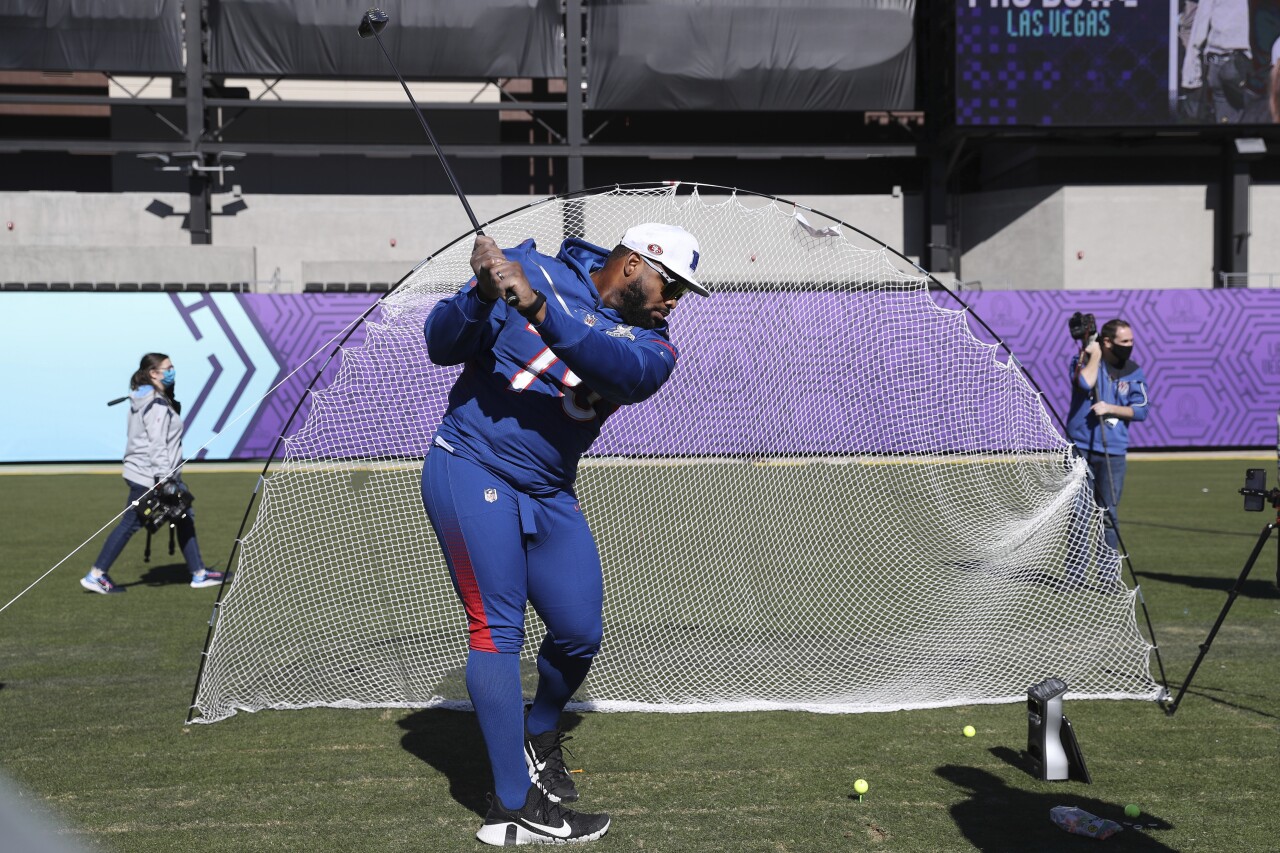 San Francisco 49ers offensive guard Laken Tomlinson swings golf club after Pro Bowl practice in 2022