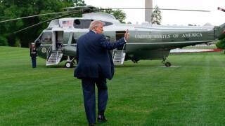 President Donald Trump waves to reporters as he walks to board Marine One on the South Lawn of the White House, Friday, May 8, 2026, in Washington.