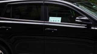Car with Uber in the window