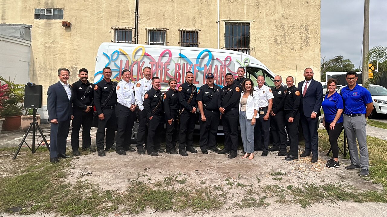 Operators of the Jack the Bike Man nonprofit reunited with West Palm Beach Fire Rescue crews on April 16, 2025, after a fire severely damaged the organization's warehouse.