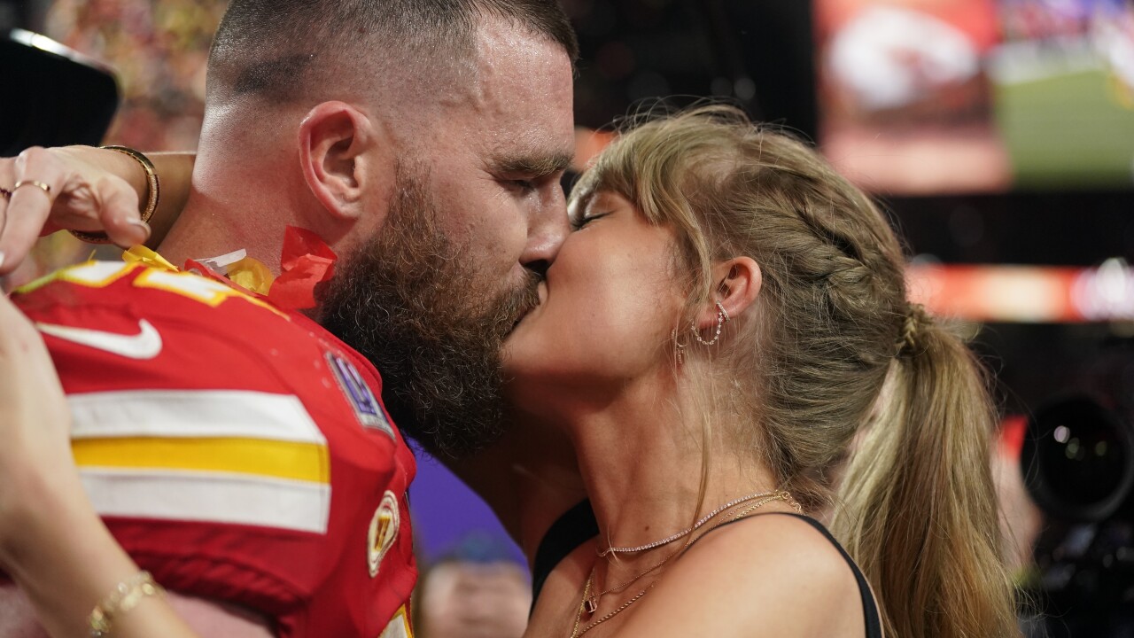 Taylor Swift kisses Kansas City Chiefs tight end Travis Kelce after NFL Super Bowl 58.