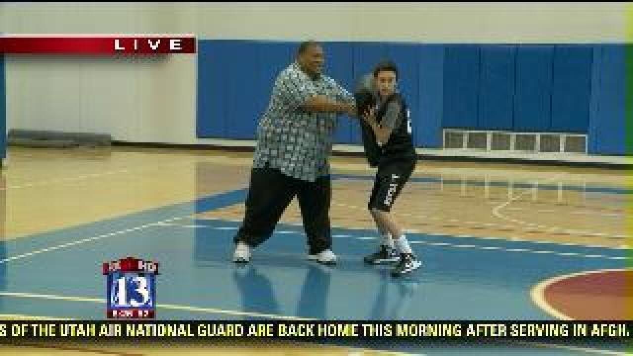 Big Budah joins basketball practice
