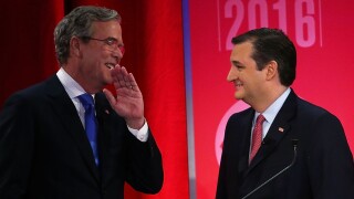 Jeb Bush talks to Ted Cruz during a break of a CBS News GOP Debate.