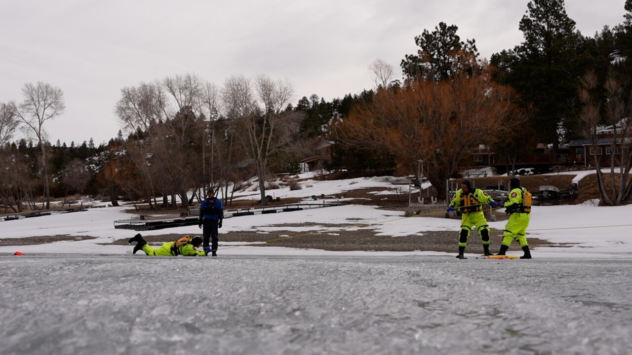 Pulling volunteer out of the water
