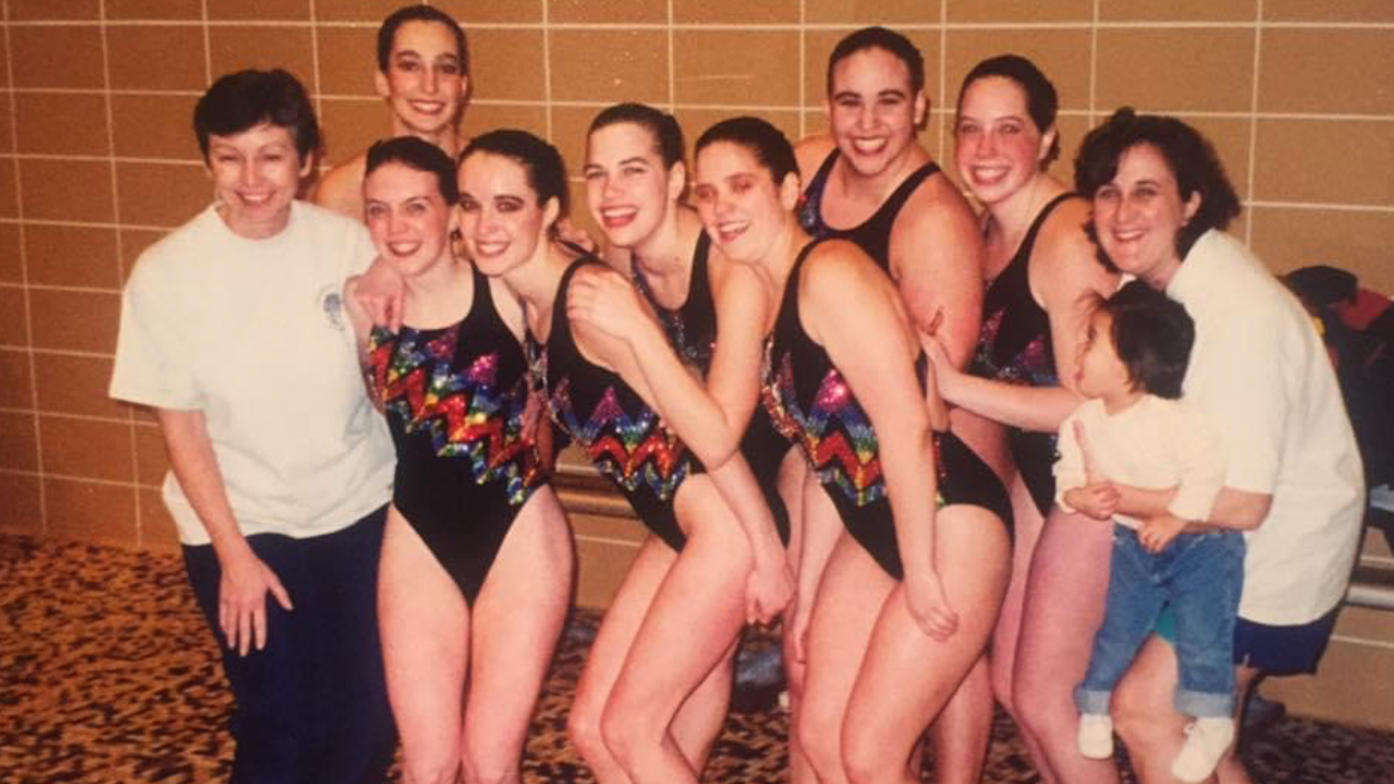 Kalie Takacs' mom is a former artistic swimmer. She is pictured on the far left end, front row. Former Town of Tonawanda Aquettes head coach and Anita Alvarez's mom, Karen Alvarez, is pictured at the far right end. She is also holding baby Anita.