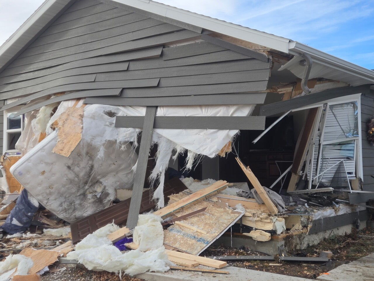 Woman killed after car pursued by MHP crashes into house