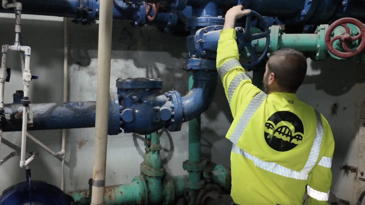 Andrew Burkhart working in water plant