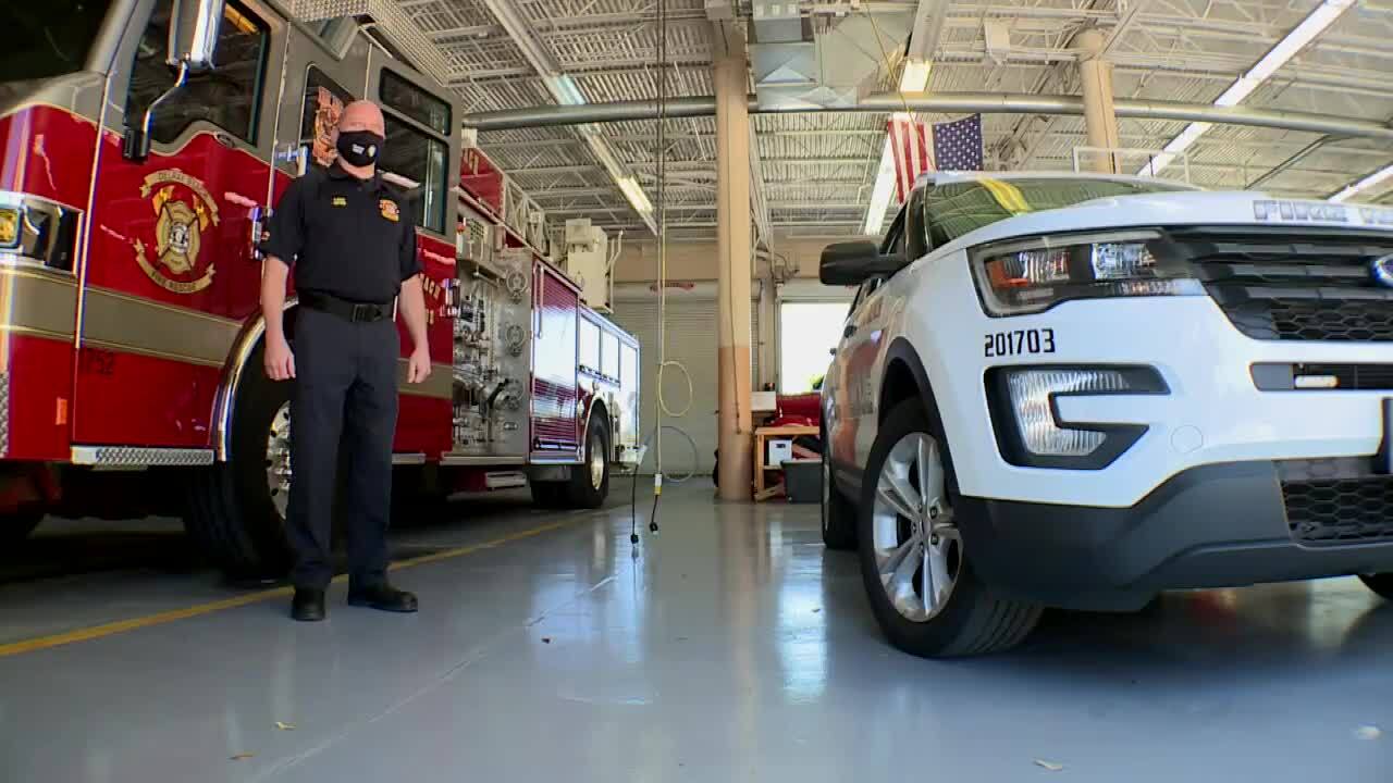 Delray Beach Fire Rescue Capt. James Bast stands next to fire engine and emergency vehicle