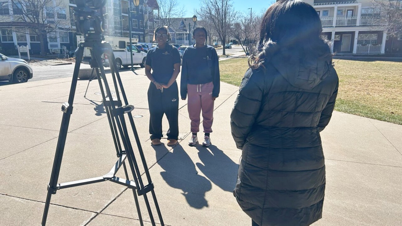 14-year-old Maliyah Thomas and 13-year-old Dallas Taylor talk with Micah Smith