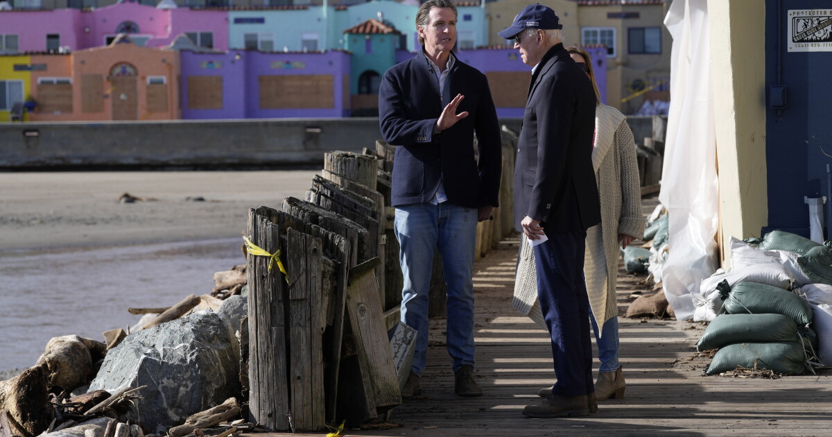 Biden tours beach town damaged by massive California storms