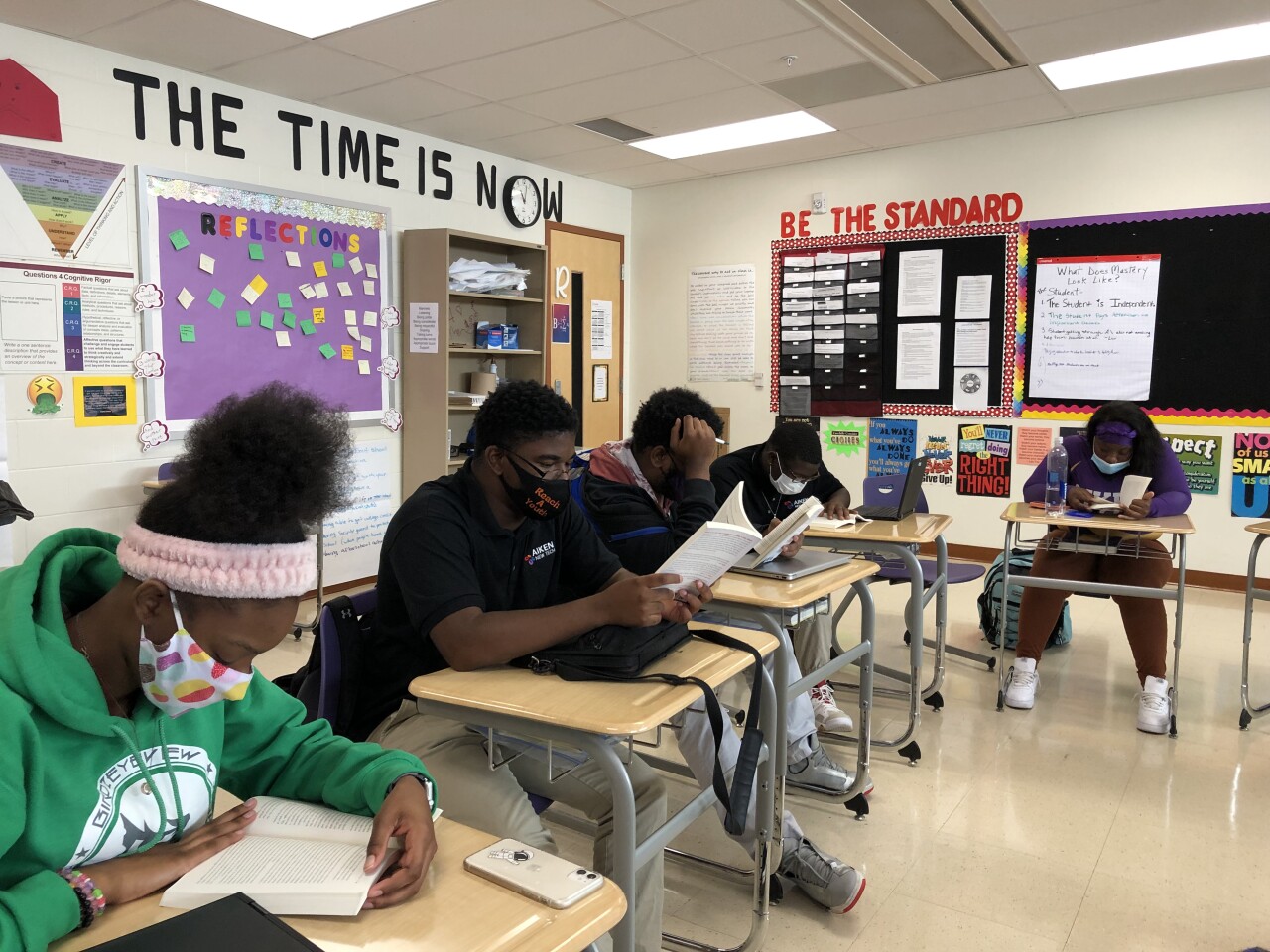 Aiken High School students read in preparation for a discussion with Keith LaMar, an inmate on death row at the Ohio State Penitentiary.