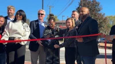 Ribbon cutting after 8 month construction project at Cesar E. Chavez ave.
