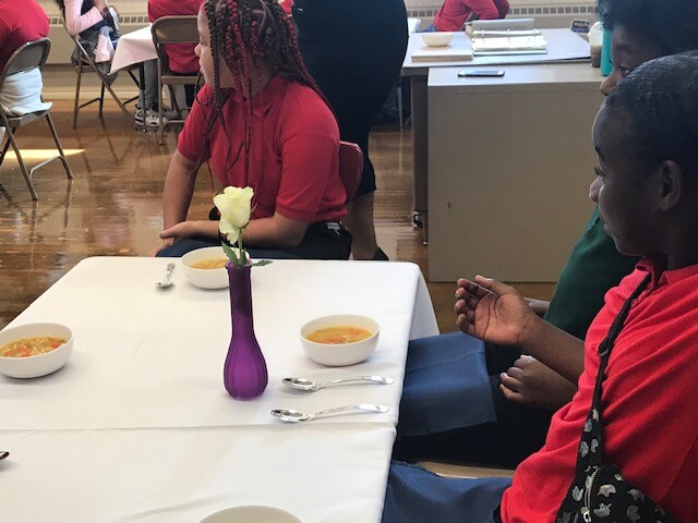 Students listen during manners class in Milwaukee