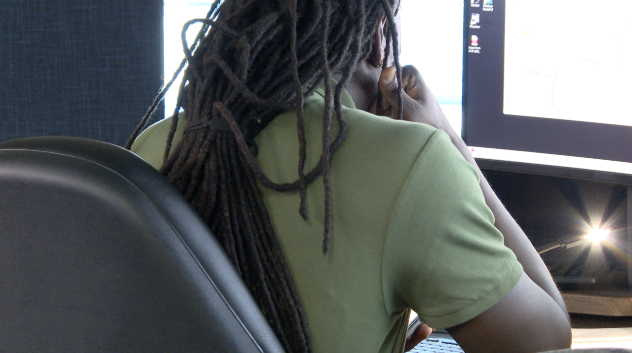 Norfolk male 911 dispatcher at computer