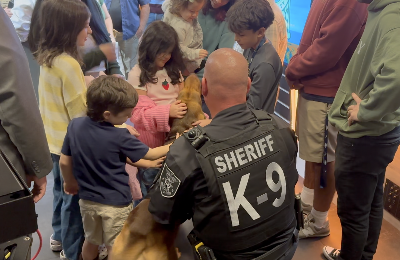 Coutinho's family petting K9 Remy
