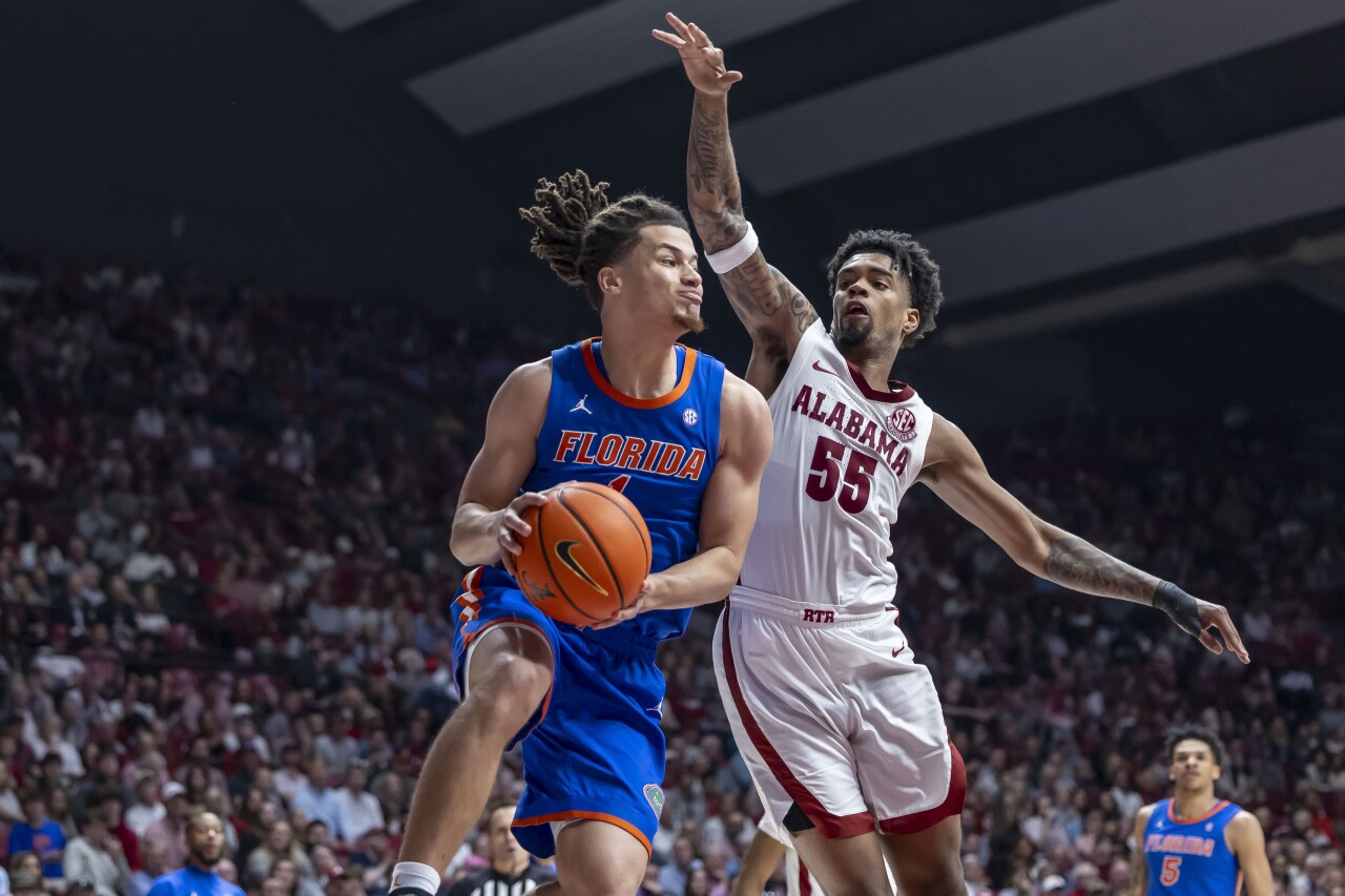 Florida Gators Walter Clayton Jr. works against Alabama Crimson Tide guard Aaron Estrada during second half, Feb. 21, 2024