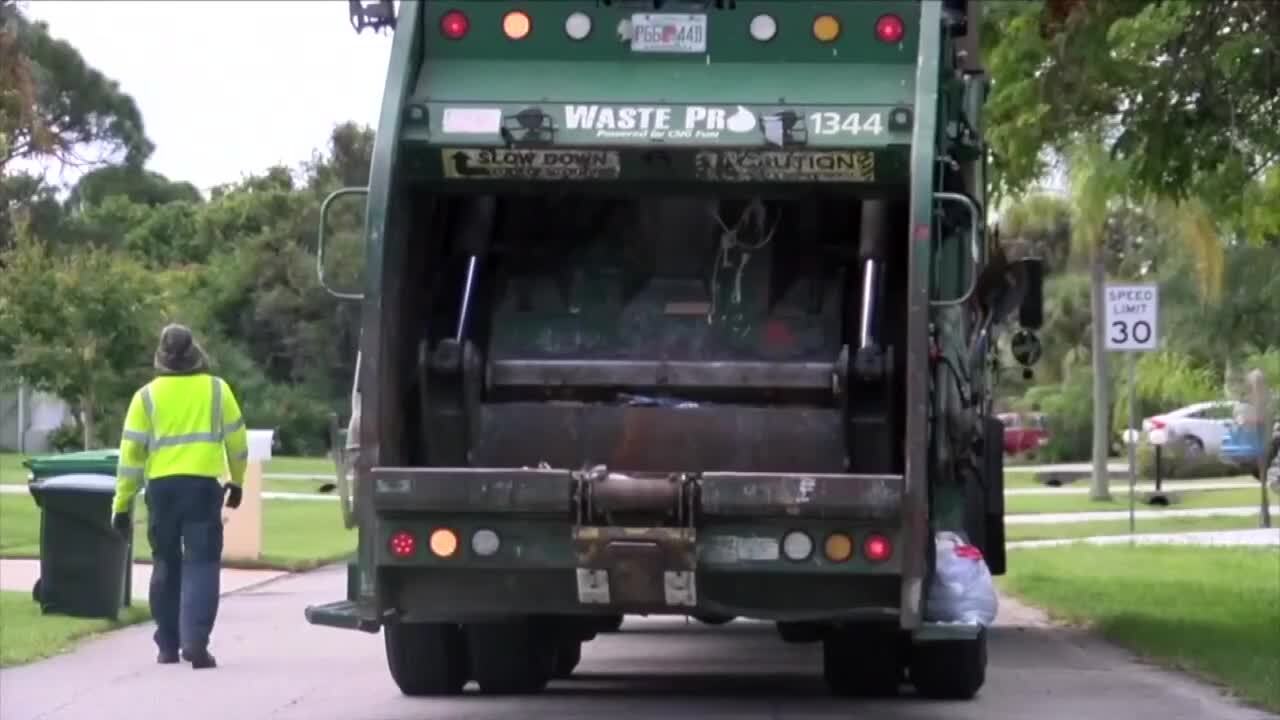 Waste Pro garbage man collects trash in Port St. Lucie