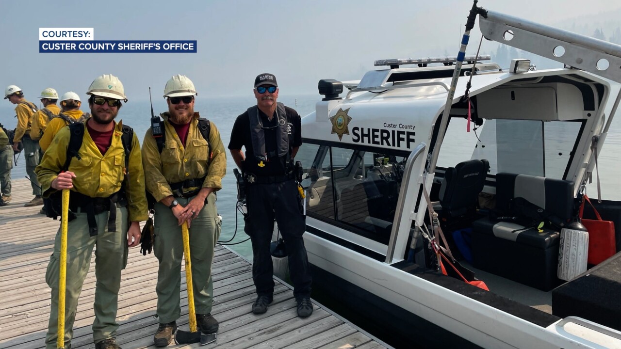John prepares to give firefighters a ride across the lake
