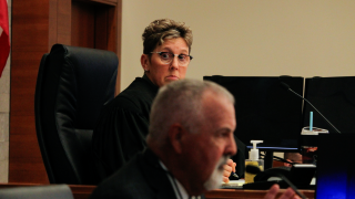 Franklin County Court of Common Pleas Judge Karen Held Phipps listening intently as lobbyist Robin Rayfield speaks