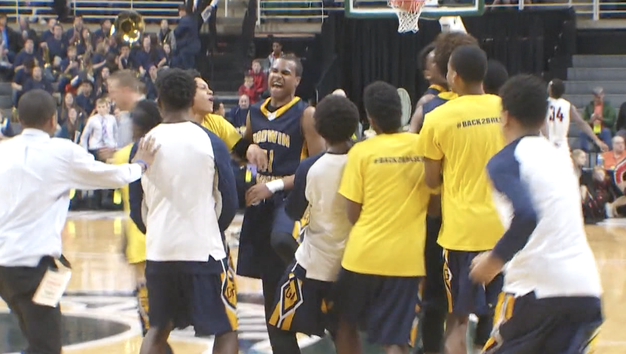 Godwin Heights celebrates a state semifinal victory over Milan