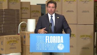 Gov. Ron DeSantis holds a news conference at Good Greek Moving and Storage near West Palm Beach on Dec. 10, 2025.