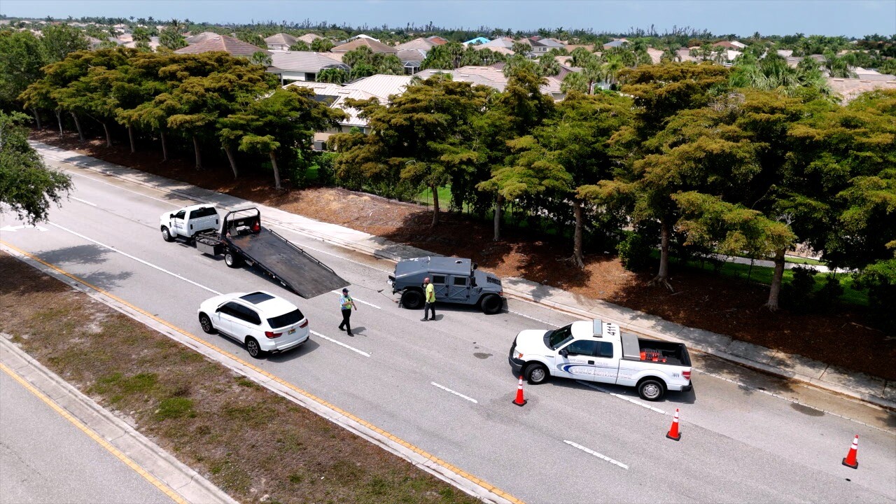 Surfside Boulevard closed to one lane of traffic as the Humvee was pulled onto a flatbed.