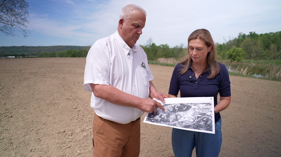 Doug Evans, owner of Evans Landscaping, shows WCPO 9 I-Team reporter Paula Christian a CAGIS map of his land from 1932 during an April 17, 2026, interview.