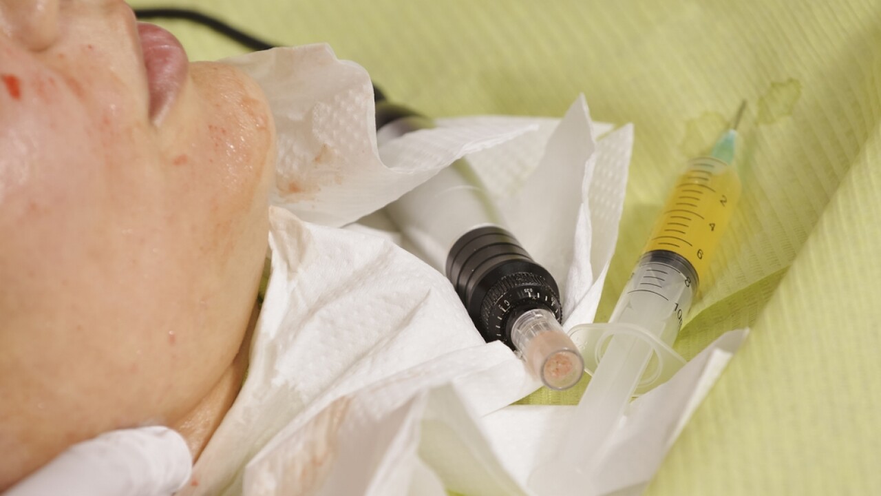 A person receives a facial treatment.