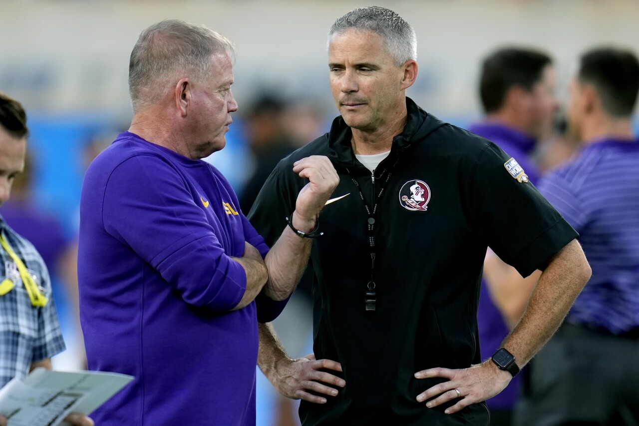 LSU Tigers head coach Brian Kelly and Florida State Seminoles head coach Mike Norvell talk before game, Sept. 3, 2023