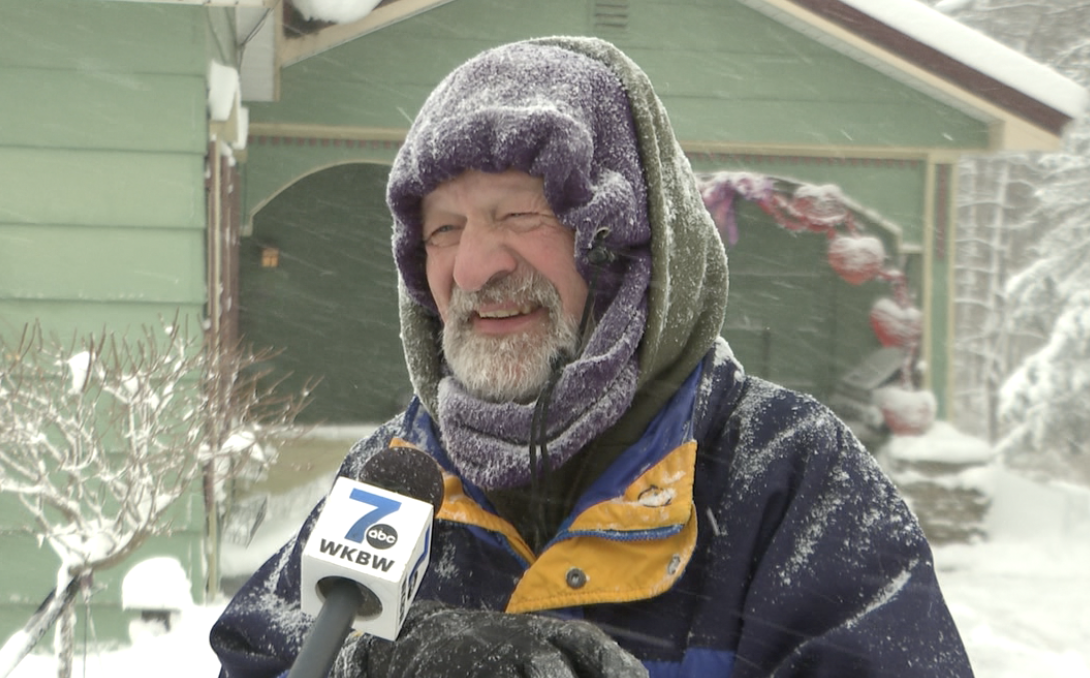 Edsinsky smiling through the snow