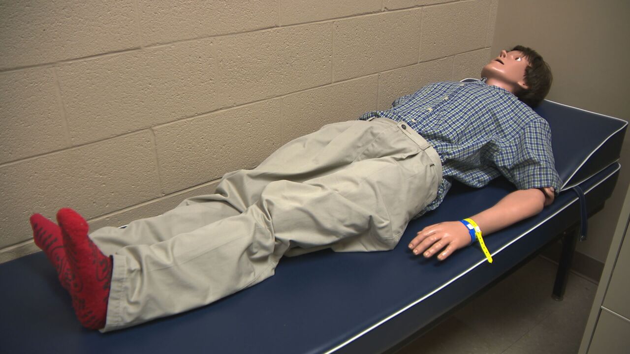 CPR dummy on nurse bed