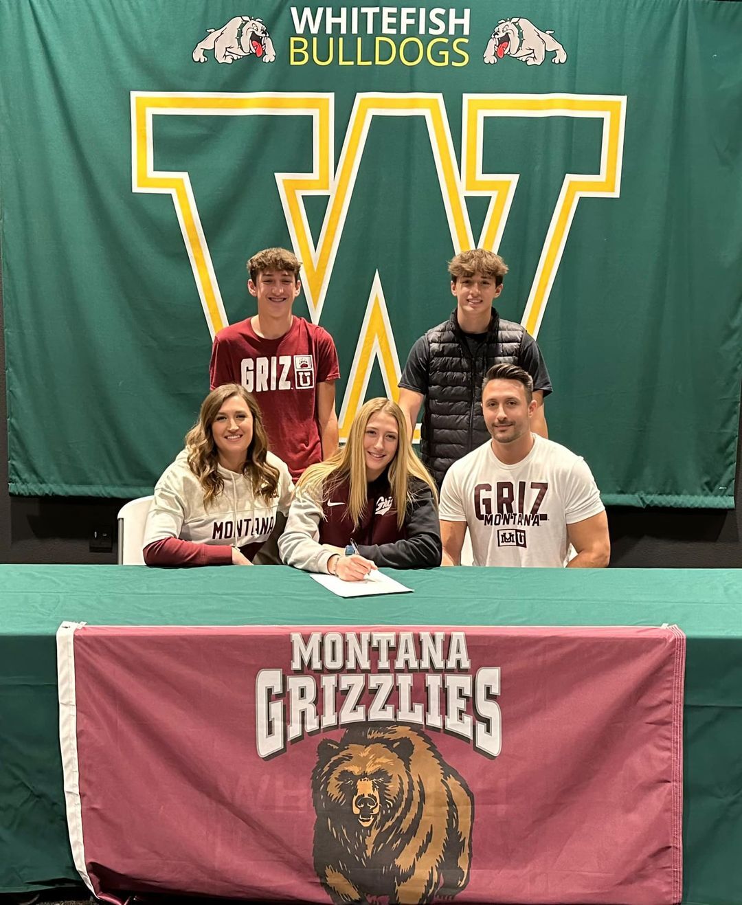 brooke signing with fam.jpeg