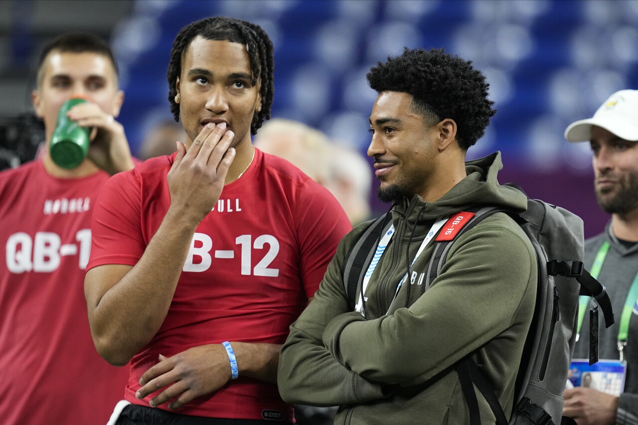 Ohio State Buckeyes QB CJ Stroud speaks with Alabama Crimson Tide QB Bryce Young at NFL scouting combine, March 4, 2023