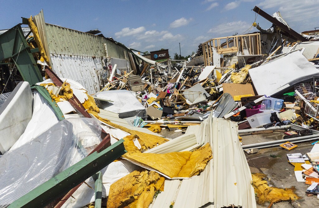 Piles of debris and rubble from buildings in Arkansas after deadly storms hit the state.