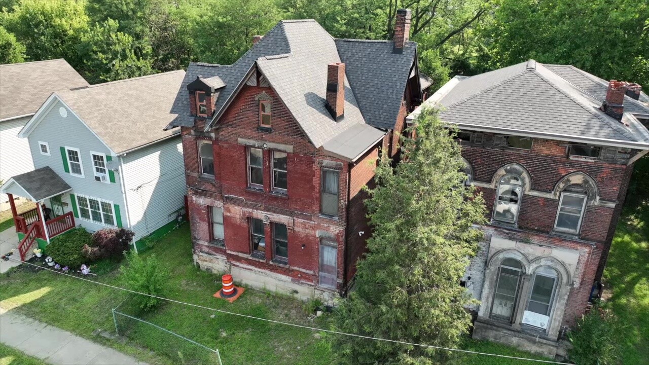 The Dall-Mays Houses are rare survivors on a street lined with homes built in the early 2000s.