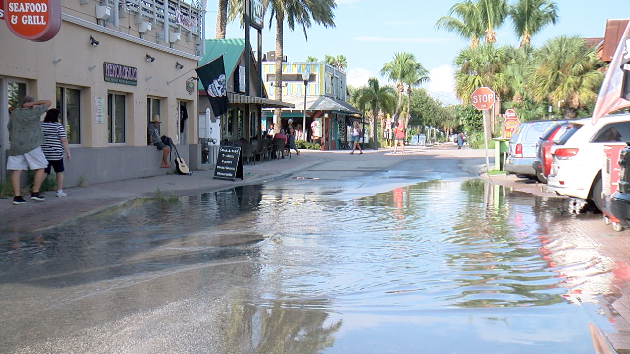 Water backs up in John's Pass Village as a result of blocked storm drains