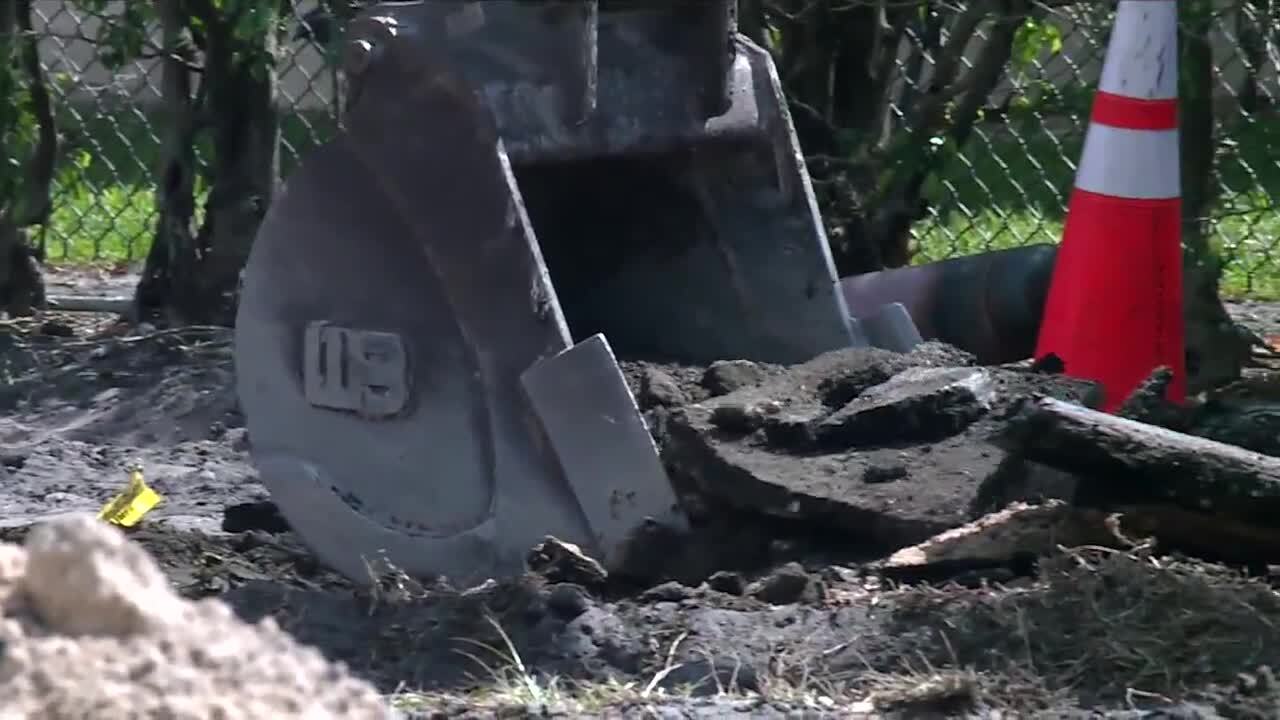 Utility crew digging up Florida Mango Road to repair ruptured sewer main line, April 10, 2024
