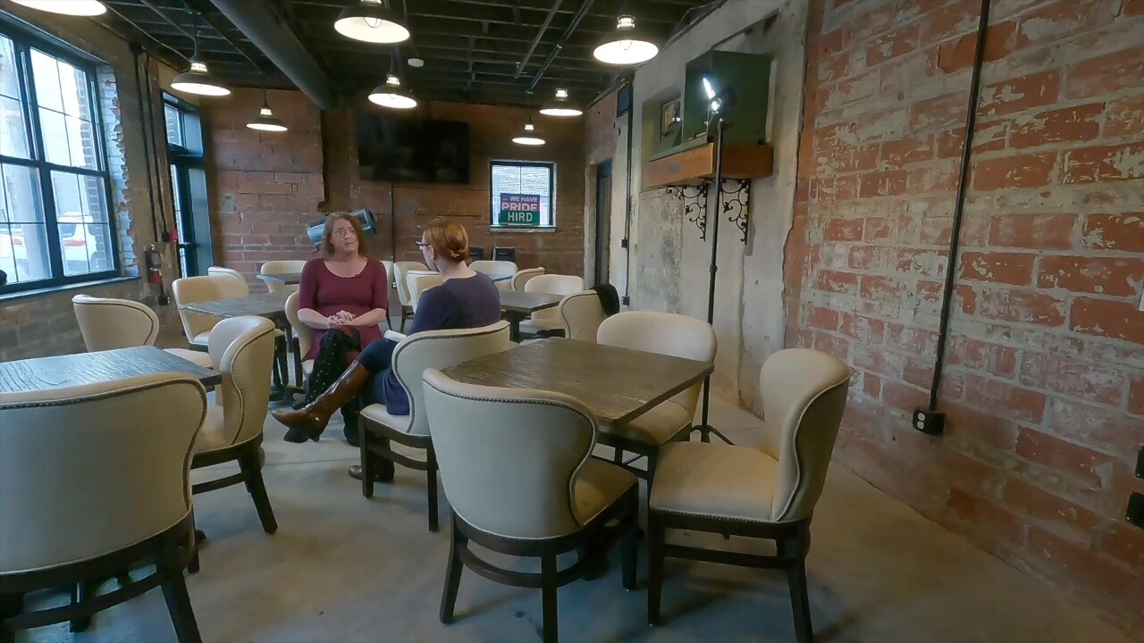 Chelsea Brennan (left), a patron and supporter of the Fieldhouse at Studio West 117, talks to News 5 reporter Michelle Jarboe.