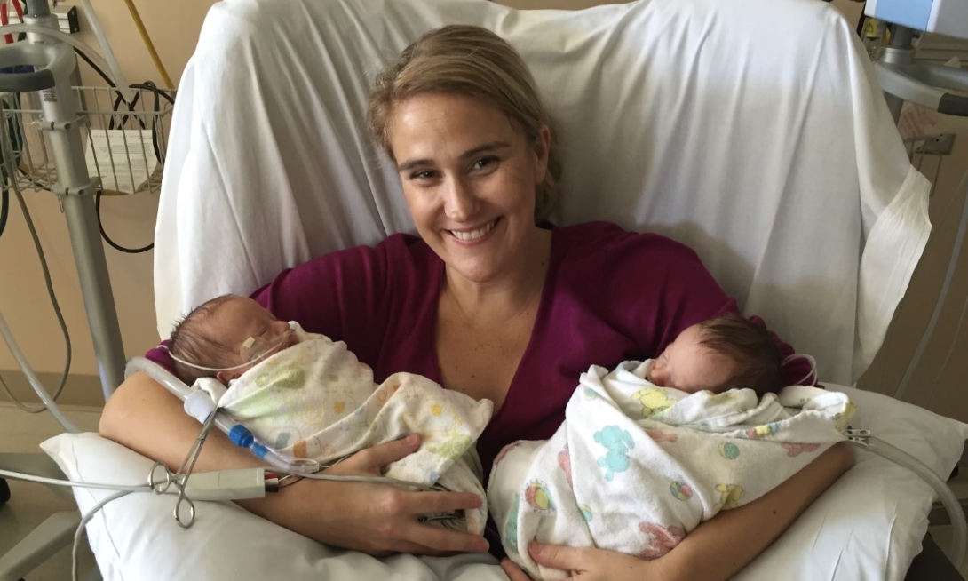 Jennifer Shipe holding her newborn twin boys Guy and Cal at the hospital.