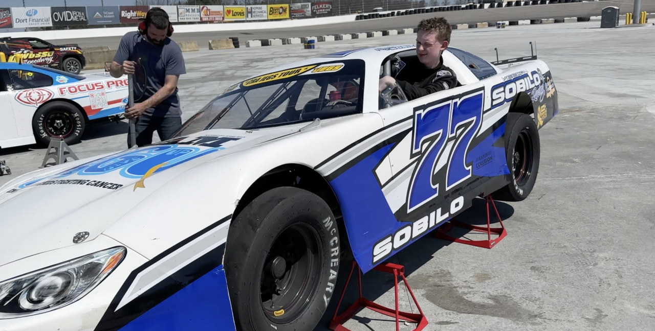 Keegan getting in his car.png
