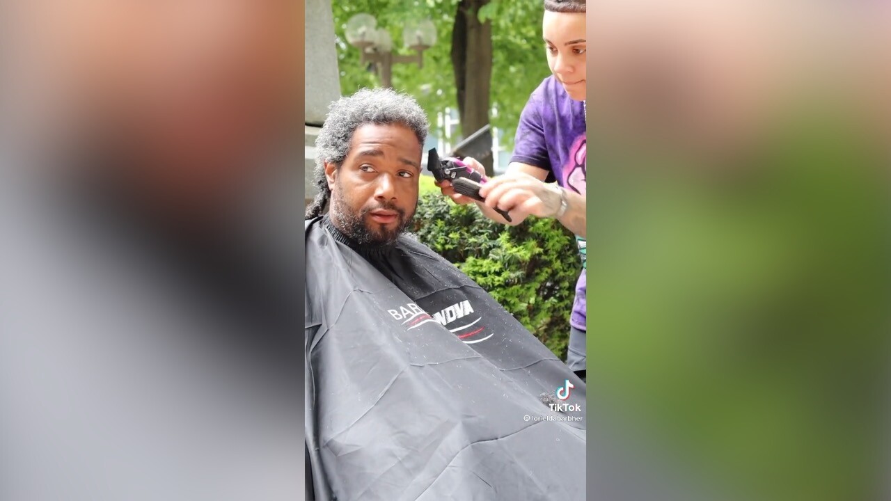 Loriel can be seen giving a free haircut here.