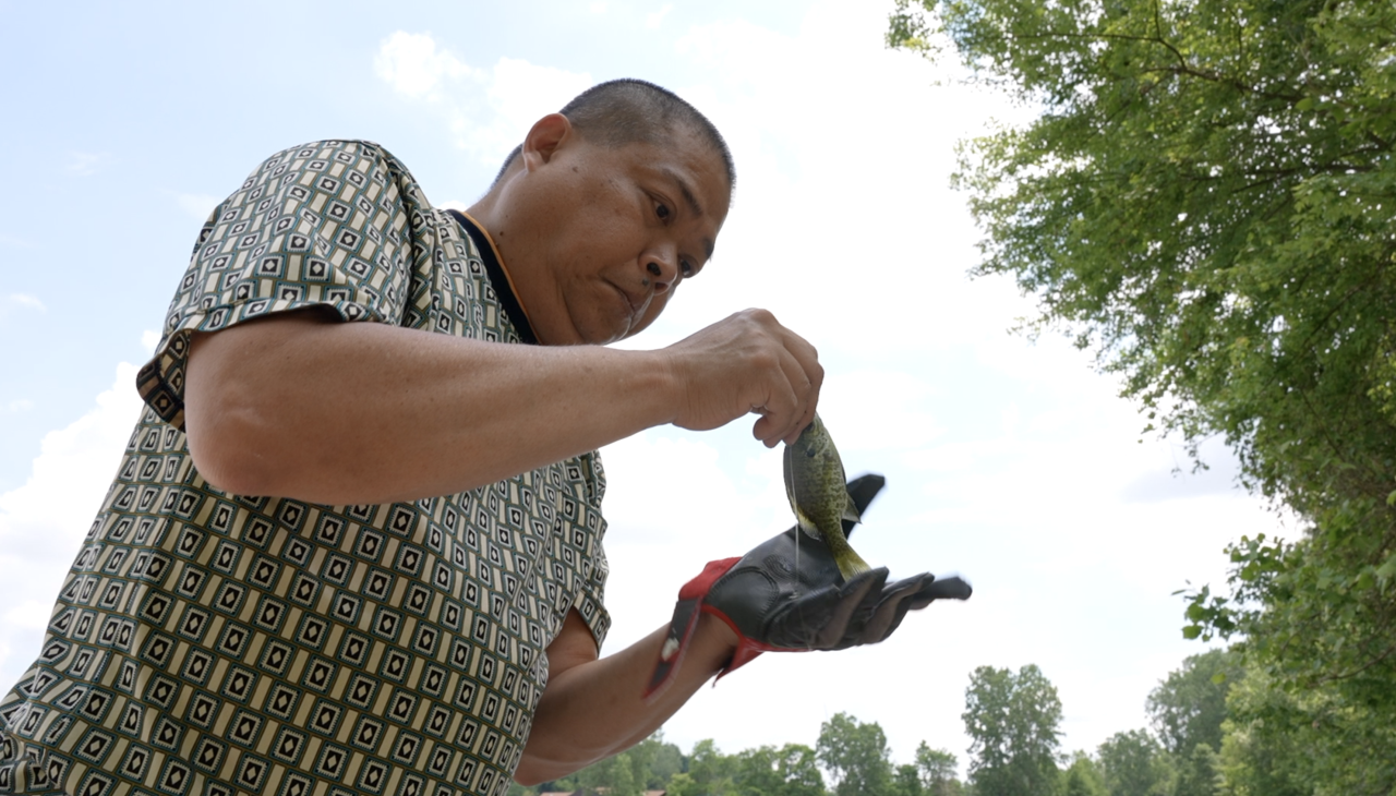 Man fishing at Hawk Island Park