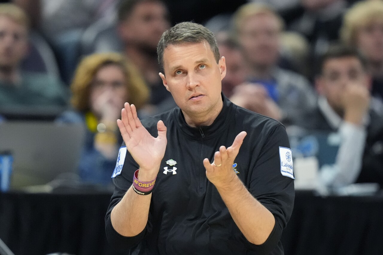 McNeese State Cowboys basketball coach Will Wade claps during NCAA tournament, March 21, 2024