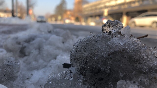 Ice-covered street with slush Friday in Milwaukee