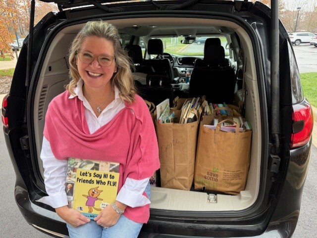 jeni with book in trunk.jpg