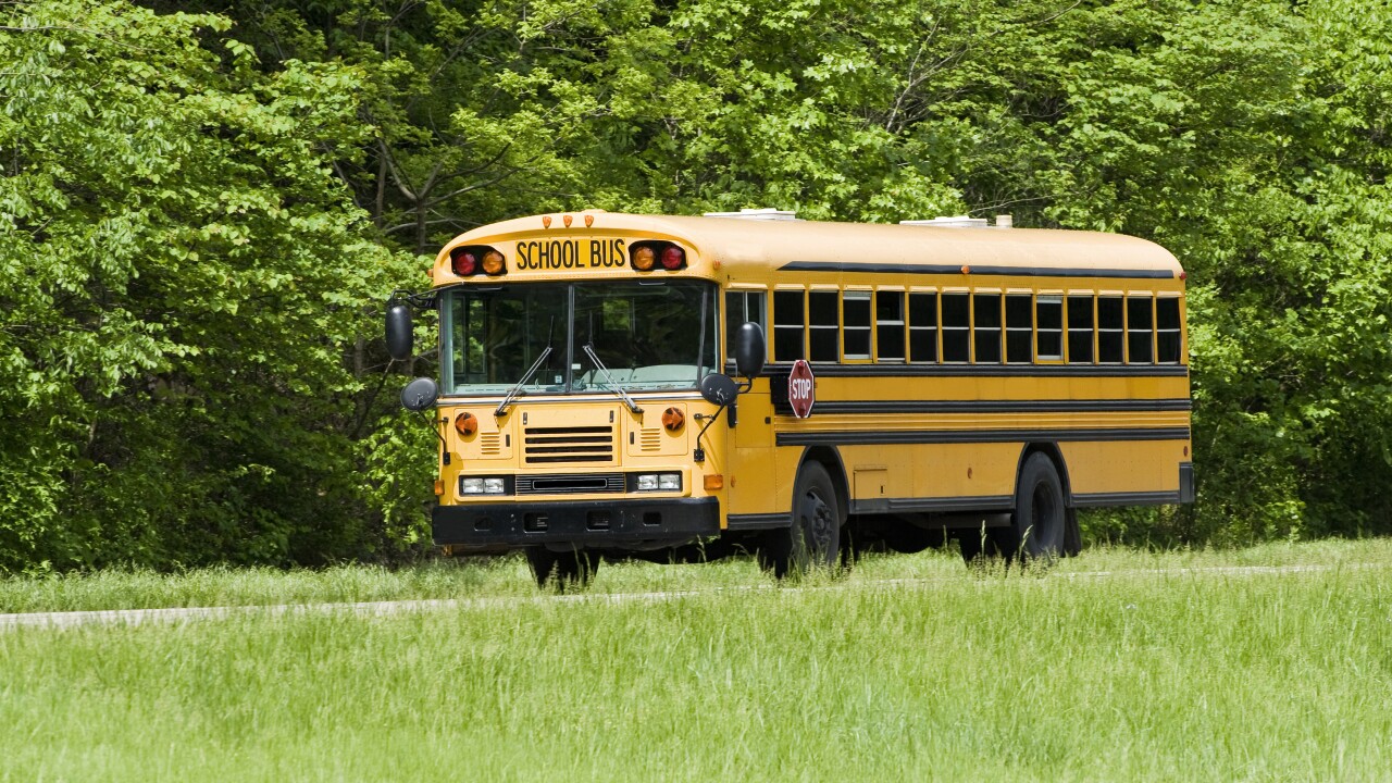 School Bus Traveling On Interstate in Springtime